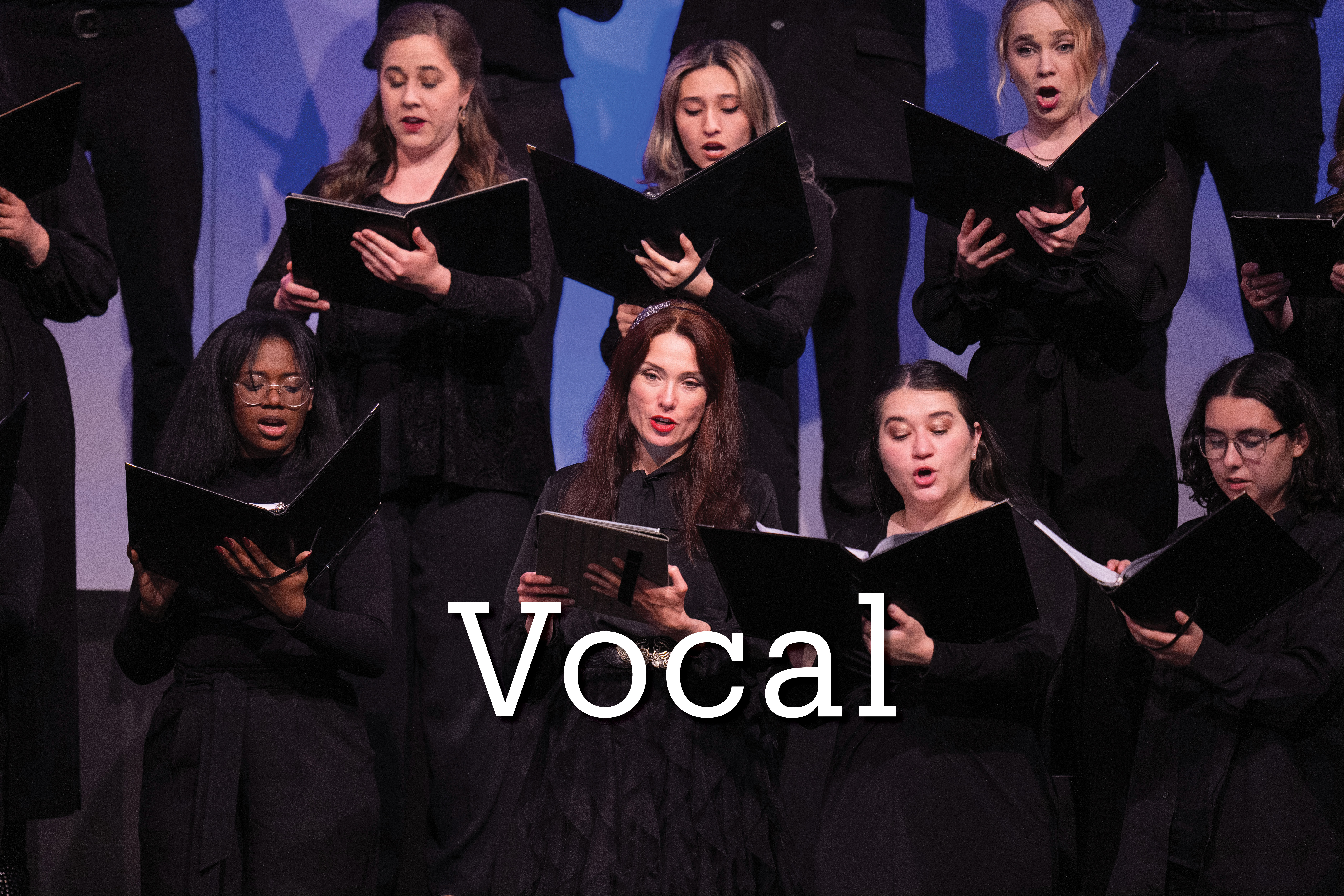 Choir members singing with text overlaid vocal