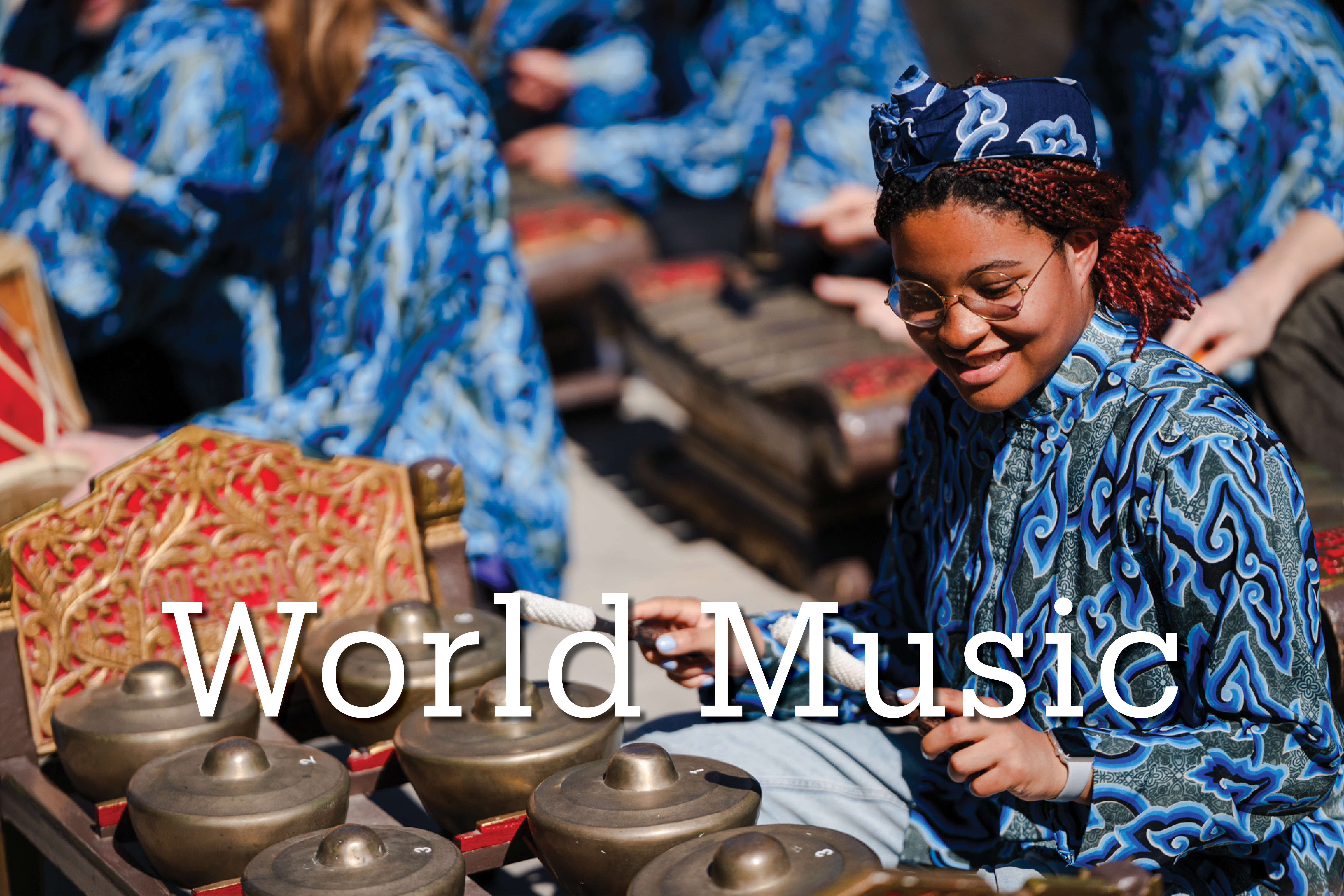 UCSB student playing instrument in gamelan ensemble with text overlaid World Music